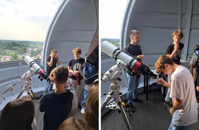 uczniowie przy teleskopach w obserwatorium astronomicznym